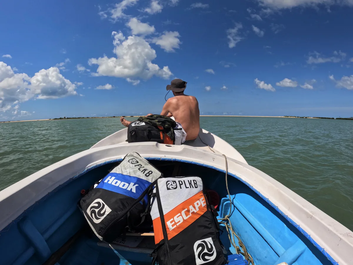 Boat heading to a remote kite spot on the Kalpitiya lagoon with kite gear on board