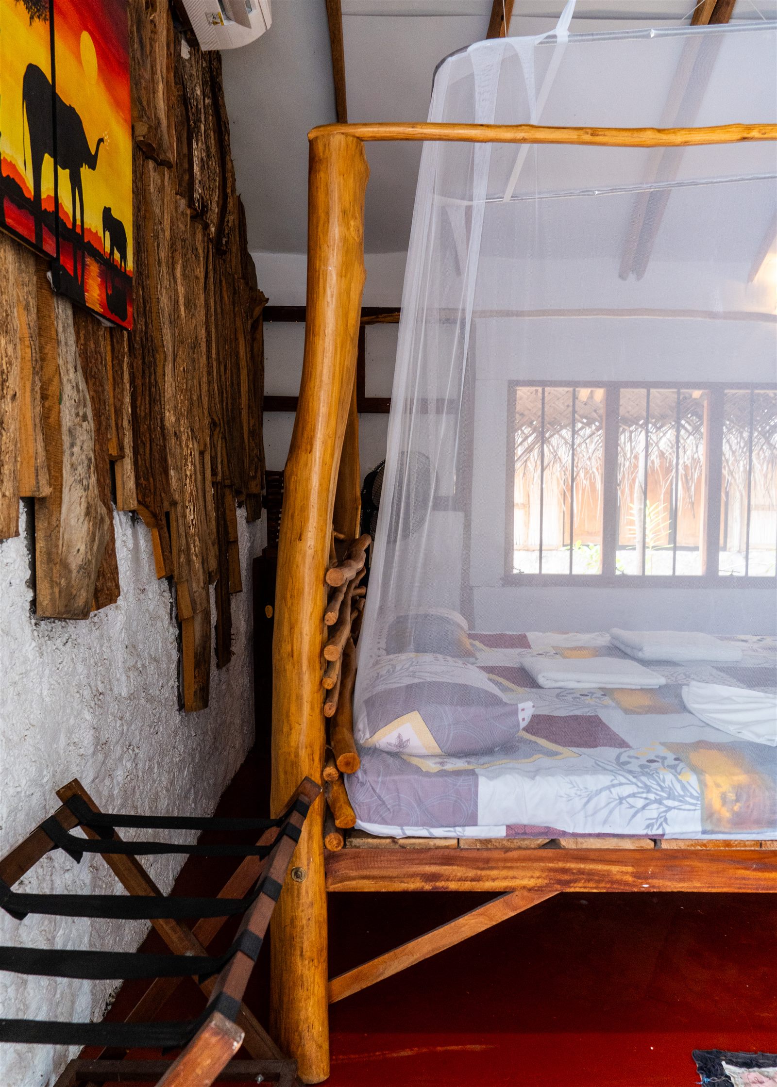 Valampuri Garden Eco Chalet rustic bed canopy detail