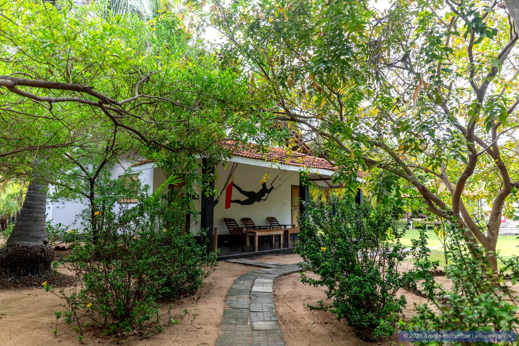 Garden path entrance to the Poolside Comfort Chalet