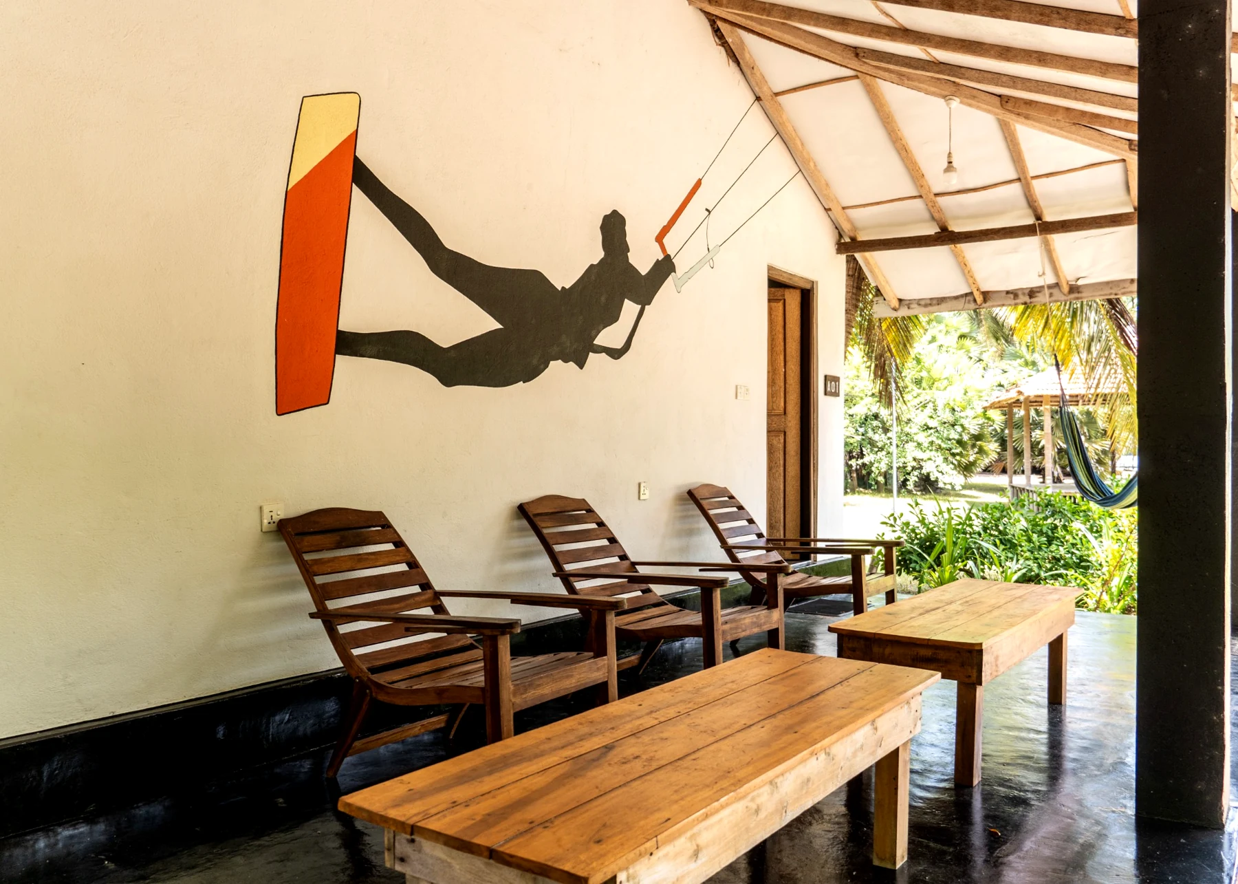 Private veranda seating at the Poolside Comfort Chalet